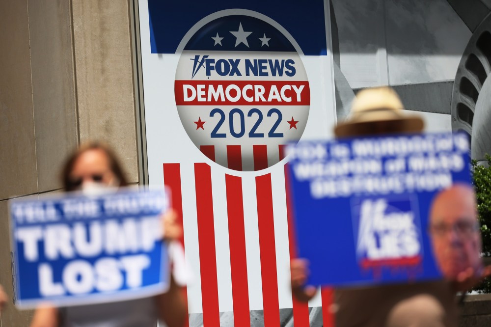 People protest outside Fox News headquarters in New York
