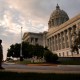 People walk past the Missouri State Capitol in Jefferson City, Mo.