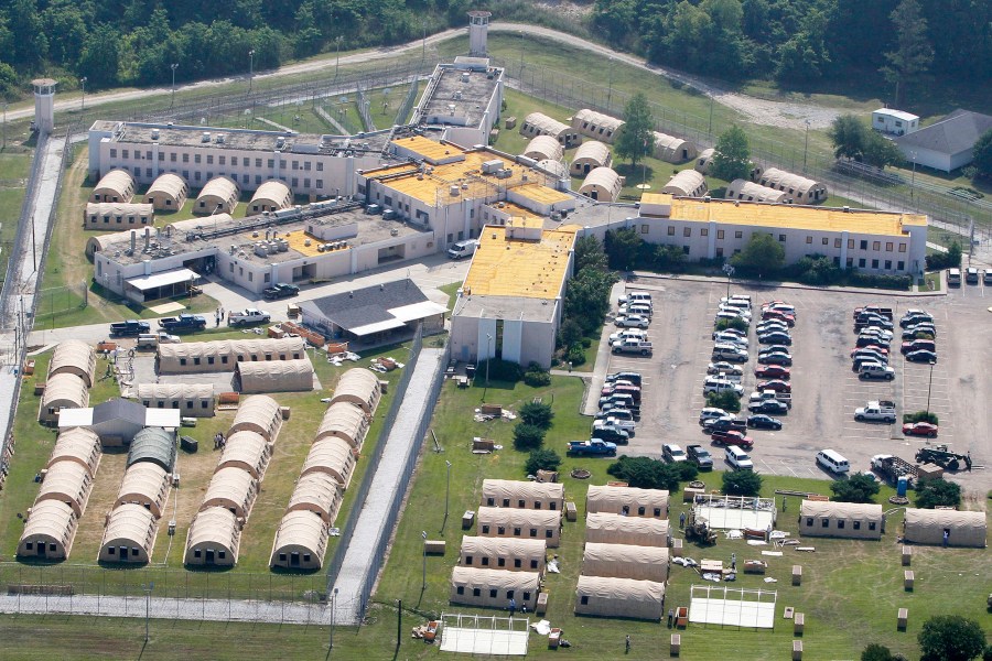 FILE - In this May 9, 2011, file photo, the Louisiana State Penitentiary at Angola, La., is viewed. As summer approaches in Louisiana, prison officials insist that ice, fans and cold showers are enough to protect death-row inmates from dangerous heat and humidity. If not, a federal judge may order them to install air conditioning for inmates awaiting execution at the penitentiary in Angola.