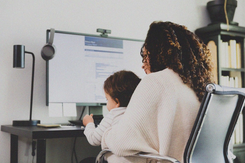 Mom cares for son while working.