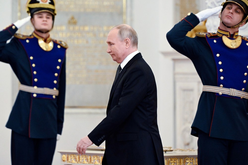Russian President Vladimir Putin arrives to attend a ceremony to present Gold Star medals to Heroes of Russia