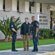 Security and law enforcement officials stand outside the Paul G. Rogers Federal Building and US Courthouse