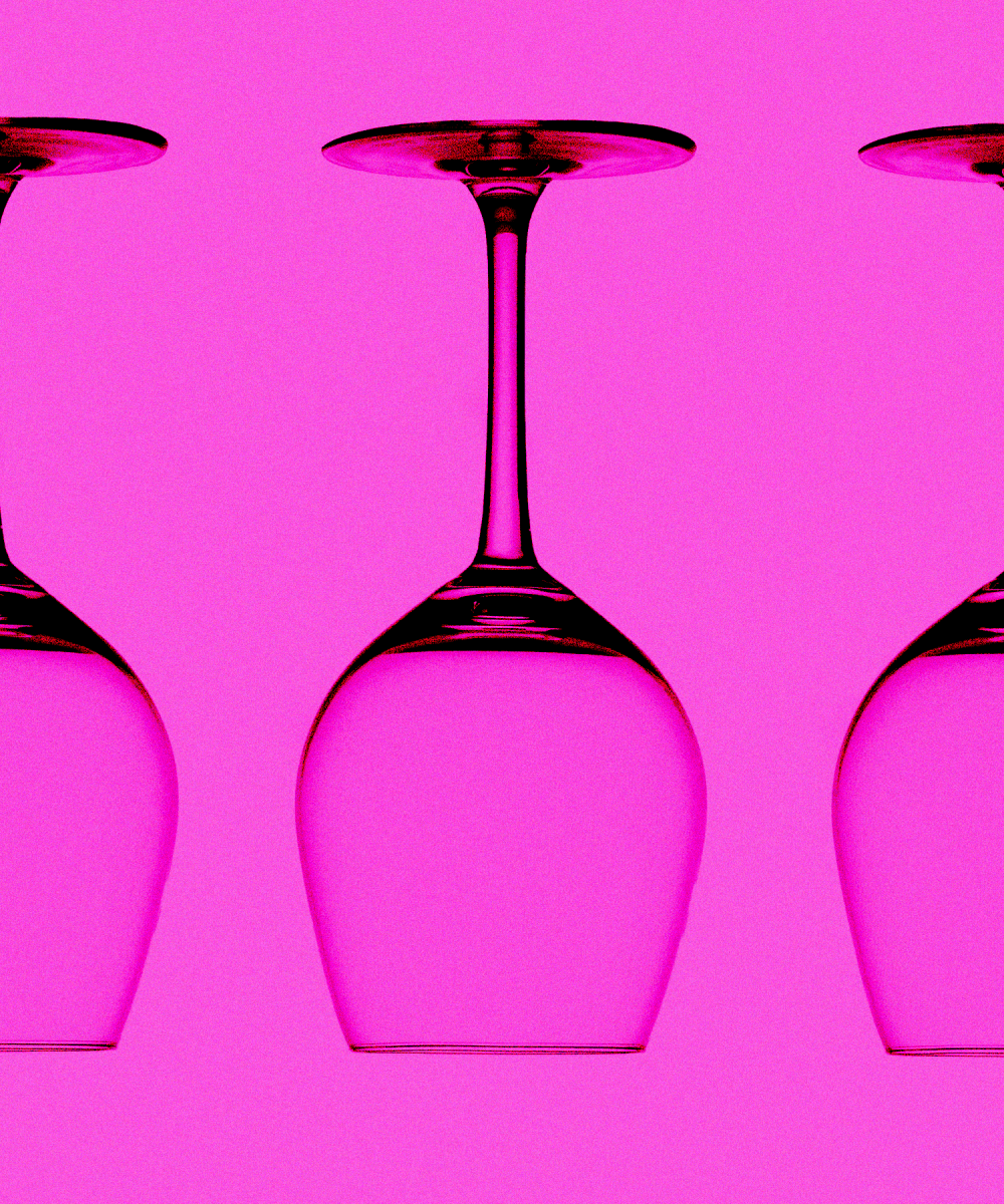 three empty, upside down wine glasses