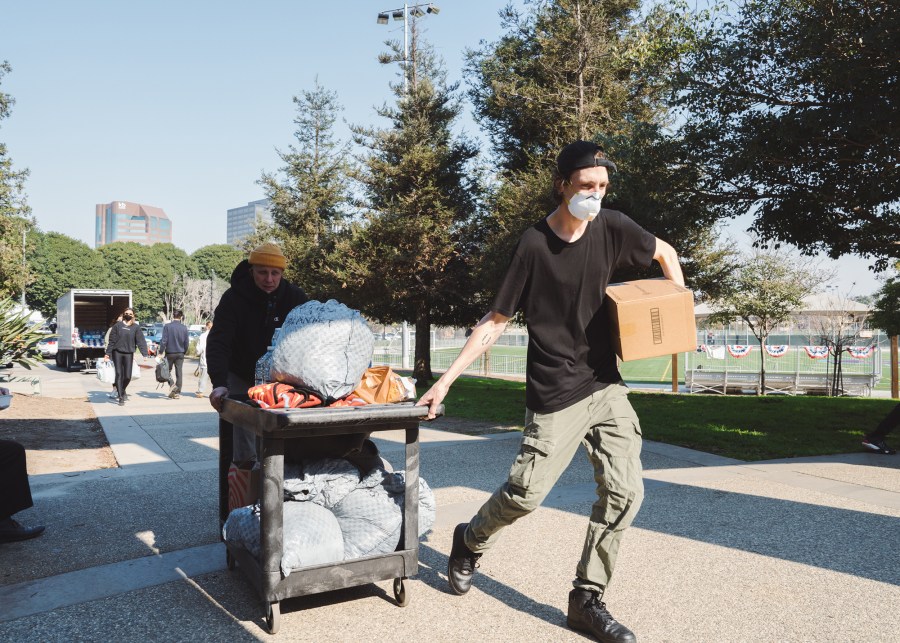 Volunteers distribute water and other supplies at Westwood Recreation Center on Thursday, Jan. 9, 2025.