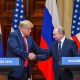 President Donald Trump and Russia's President Vladimir Putin shake hands