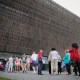 People wait in line to enter the Smithsonian National Museum of African American History and Culture on the National Mall in in 2017.
