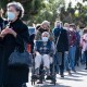 People wait in line to get the vaccine.