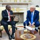 Cyril Ramaphosa gestures while he speaks with Donald Trump.