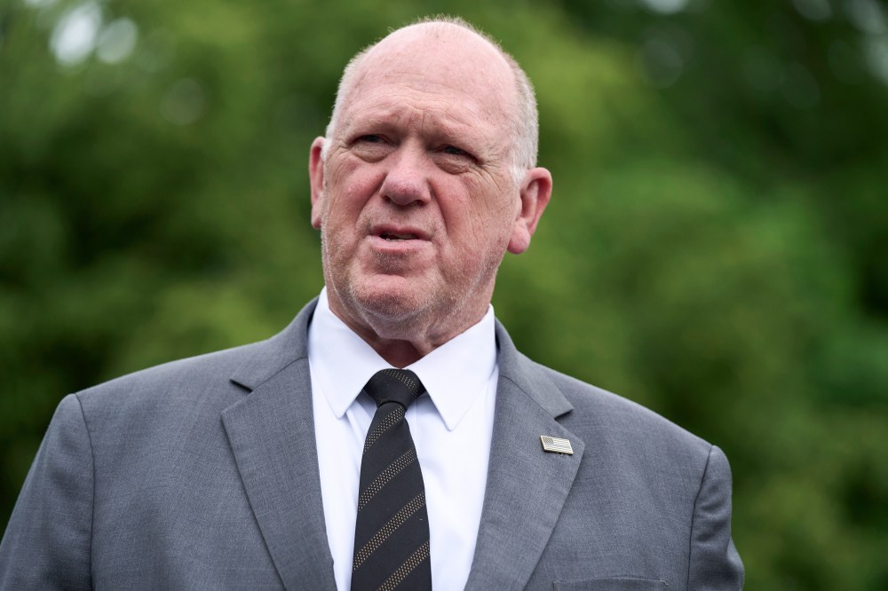 Tom Homan speaks while standing outside