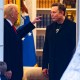 Donald Trump, left, points a finger at Elon Musk inside of an office while standing