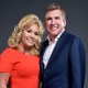 Julie and Todd Chrisley  pose for a portrait.