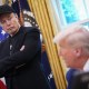 Elon Musk listens as President Donald Trump speaks in the Oval Office on May 30.