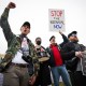 Protesters shout during a "Veterans March" at the National Mall on March 14, 2025.