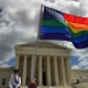 A supporter of same-sex marriage waves his rainbow flag