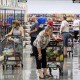 Shoppers browse the frozen food cases