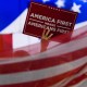 A delegate waves an "America First" sign at the 2024 Republican National Convention in Milwaukee.