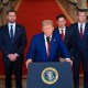 President Donald Trump speaks at a lectern at the White House