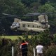 A Chinook helicopter takes off near Camp Mystic