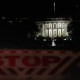 A security barrier near the White House  at night