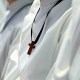 Acolytes wear wooden crosses around their necks
