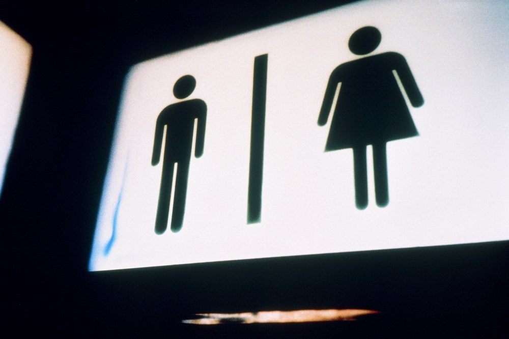 A sign for men and women's bathrooms. (Photo by Vincent Mo/Corbis)