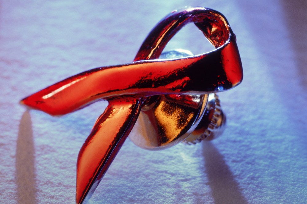 An AIDS awareness ribbon rests. (Photo by Christian Schmidt/Corbis)