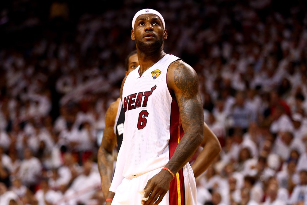 LeBron James looks on against the San Antonio Spurs during Game Four of the 2014 NBA Finals, June 12, 2014 in Miami, Florida.