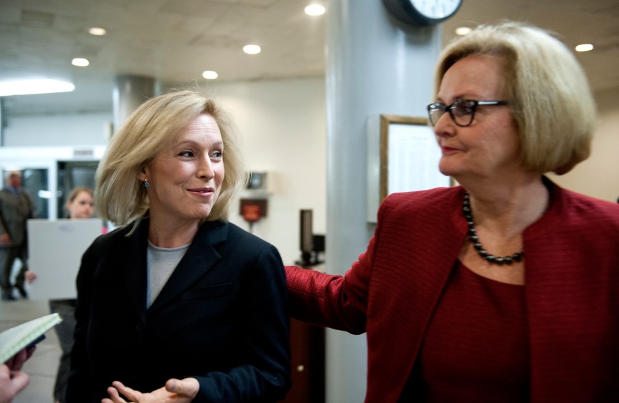 Senators Kristen Gillibrand (D-NY) and  Claire McCaskill (D-MO) talk with reporters at the U.S. Capitol on Nov. 20, 2013.