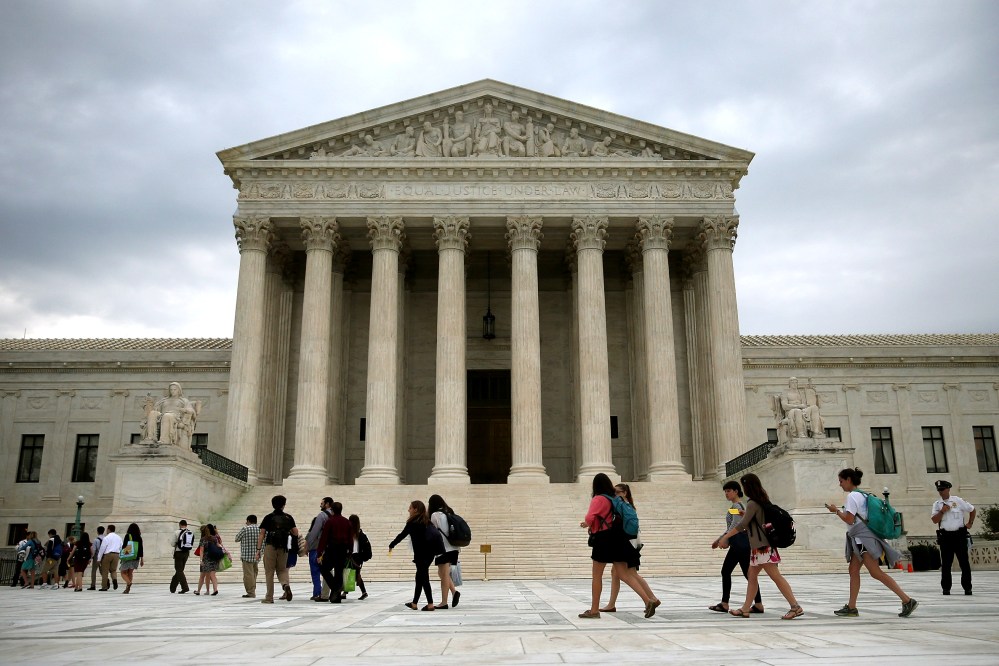 People arrive to attend the final session of the term at the U.S. Supreme Court on June 30, 2014 in Washington, DC.
