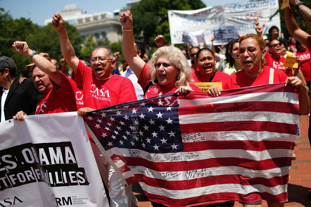 Immigration reform protesters march during an immigration rally July 7, 2014 in Washington, D.C. (Photo by Win McNamee/Getty)