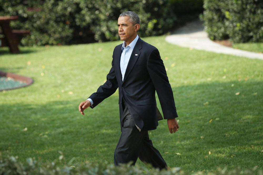 President Barack Obama walks out of the White House before making a statement on the South Lawn of the White House on Aug. 9, 2014 in Washington, D.C.