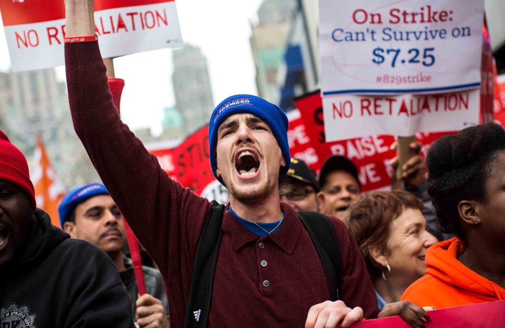 Protesters rally outside of a Wendy's in support of raising fast food wages from $7.25 per hour to $15.00 per hour on Dec. 5, 2013 in the Brooklyn borough of New York City.