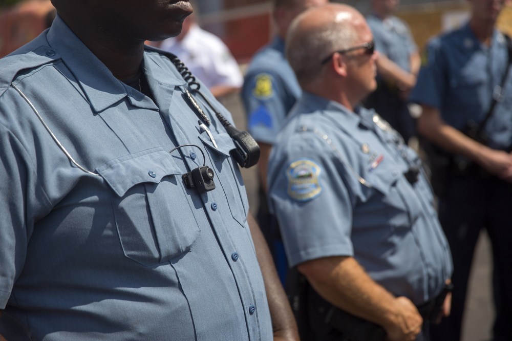 Members of the Ferguson Police department are seen during a rally on Aug. 30, 2014 in Ferguson, Mo. (Photo by Aaron P. Bernstein/Getty)