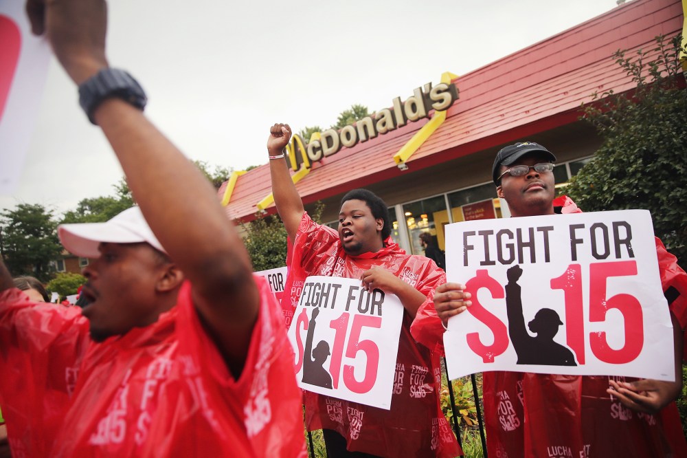 Demonstrators protest for an increase in wages for fast food and home care workers during the morning rush hour on Sept. 4, 2014 in Chicago, Illinois. (Photo by Scott Olson/Getty)