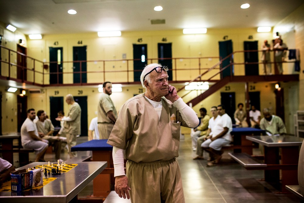 A prisoner at Rhode Island's John J. Moran Medium Security Prison walks through his cell block, Dec. 10, 2013.