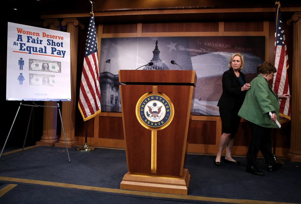Senators Barbara Mikulski (D-MD) (R) and Kirsten Gillibrand (D-NY) walk away after a news conference on the Paycheck Fairness Act, at the US Capitol, on Sept. 10, 2014 in Washington, DC.