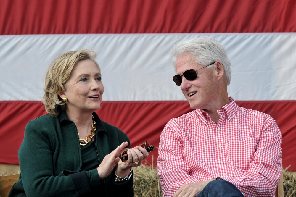 Former President Bill Clinton and his wife former Secretary of State Hillary Rodham Clinton attend the 37th Harkin Steak Fry, Sept. 14, 2014 in Indianola, Iowa.