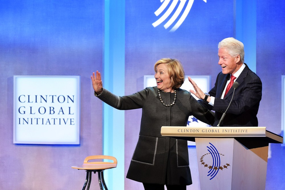 Former US Secretary of State Hillary Clinton and husband, Former U.S. President Bill Clinton address the audience during the Clinton Global Initiative on Sept. 22, 2014 New York, N.Y. (Photo by Michael Loccisano/Getty)