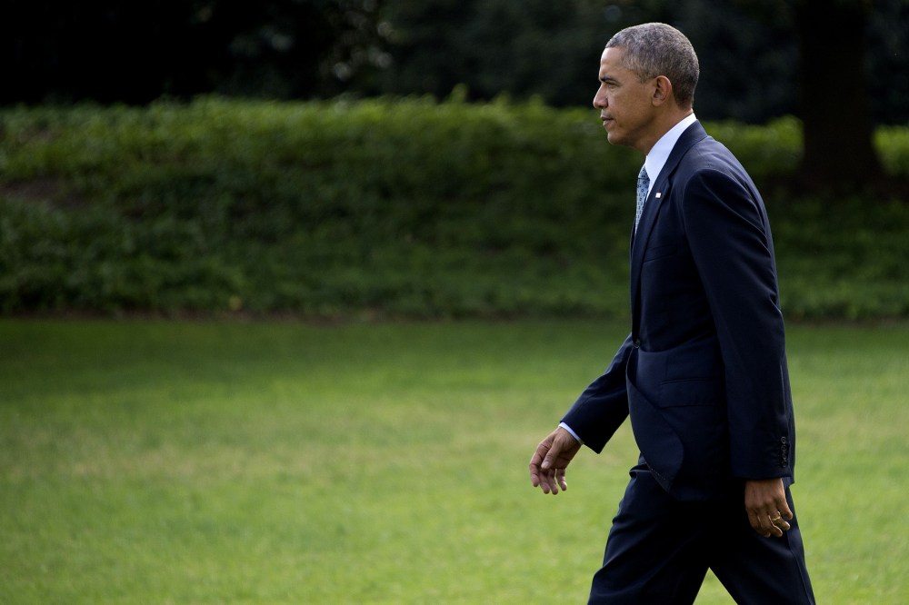 President Barack Obama departs the White House in Washington, D.C., on Oct. 14, 2014. (Photo by Jim Watson/AFP/Getty)