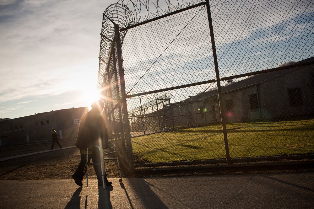 George Whitfield, age 56, uses a walker to get to the physical therapist's office at California State Prison, Solano, on December 16, 2013 in Vacaville, Calif.