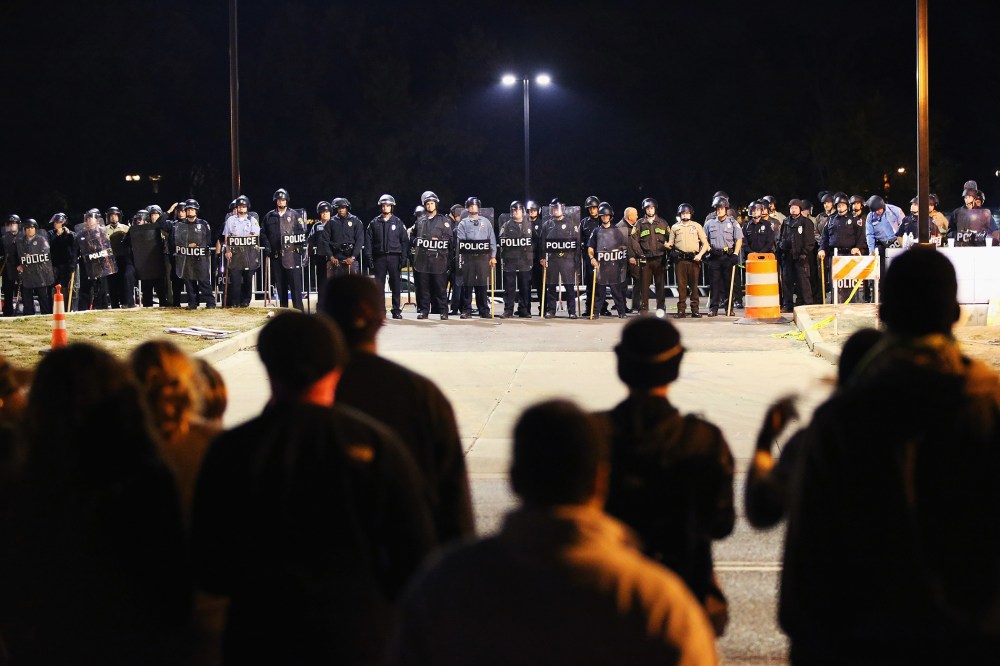 Police face off with demonstrators outside the police station as protests continue in the wake of 18-year-old Michael Brown's death on Oct. 22, 2014 in Ferguson, Mo.