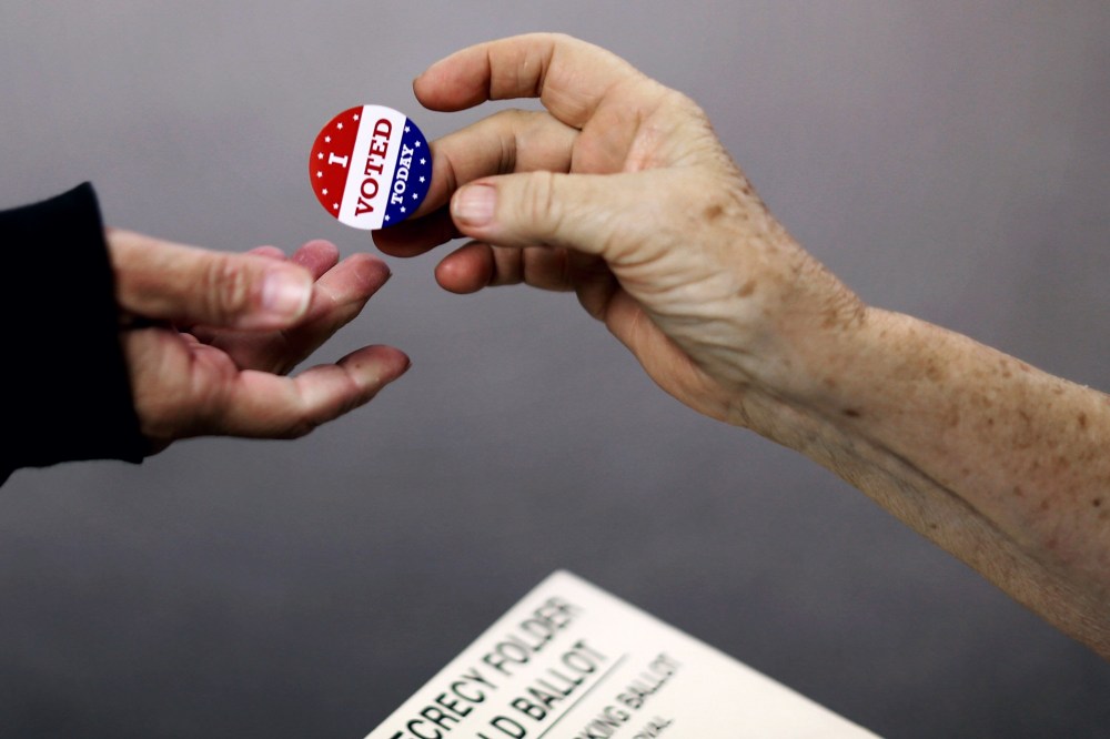 Voters get an 'I VOTED TODAY' sticker after casting their ballots on election day at the Red Oak Fire Department on Nov. 4, 2014 in Red Oak, Iowa.