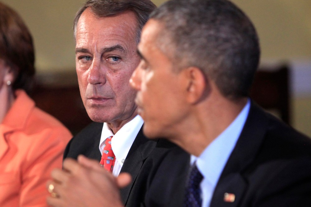 Speaker of the House John Boehner looks on as U.S. President Barack Obama meets with bipartisian congressional leadership in the Old Family Dining Room at the White House on Nov. 7, 2014 in Washington, DC.