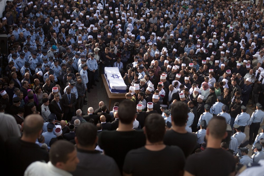 Druze men and relatives attend the funeral of Druze Israeli police officer Zidan Sif on Nov. 19, 2014 in the Druze village of Yanuh-Jat, Israel. (Lior Mizrahi/Getty)