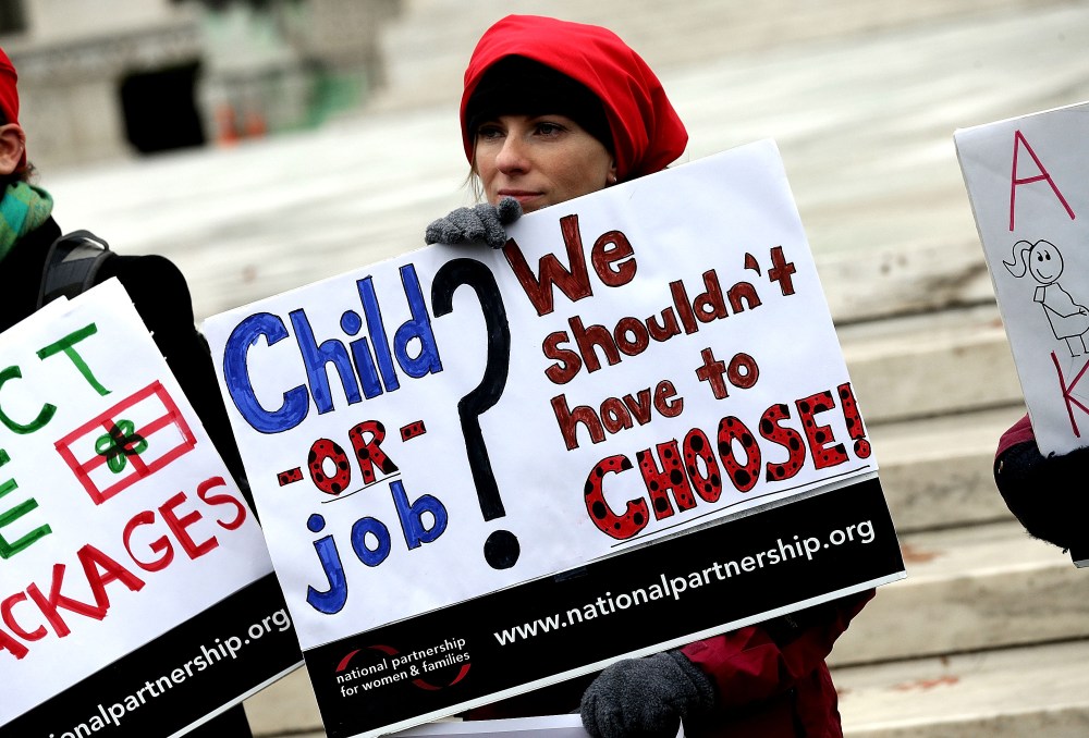Protesters gather outside the U.S. Supreme Court while the court hears arguments in the Young vs. UPS case Dec. 3, 2014 in Washington, DC. (Photo by Win McNamee/Getty)