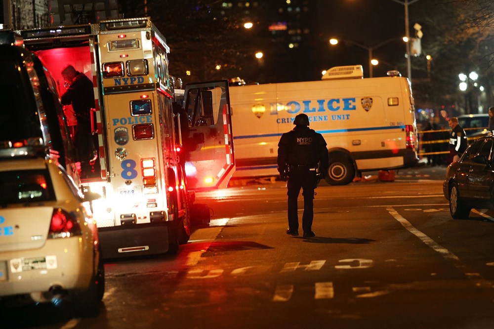 The scene at a shooting where two New York City police officers were killed execution style as they sat in their marked police car on a Brooklyn street corner on Dec. 20, 2014. (Spencer Platt/Getty)