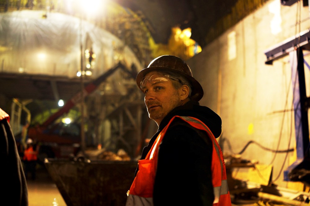 A construction worker pauses at the Second Avenue Subway project site in New York, Jan. 10, 2014.