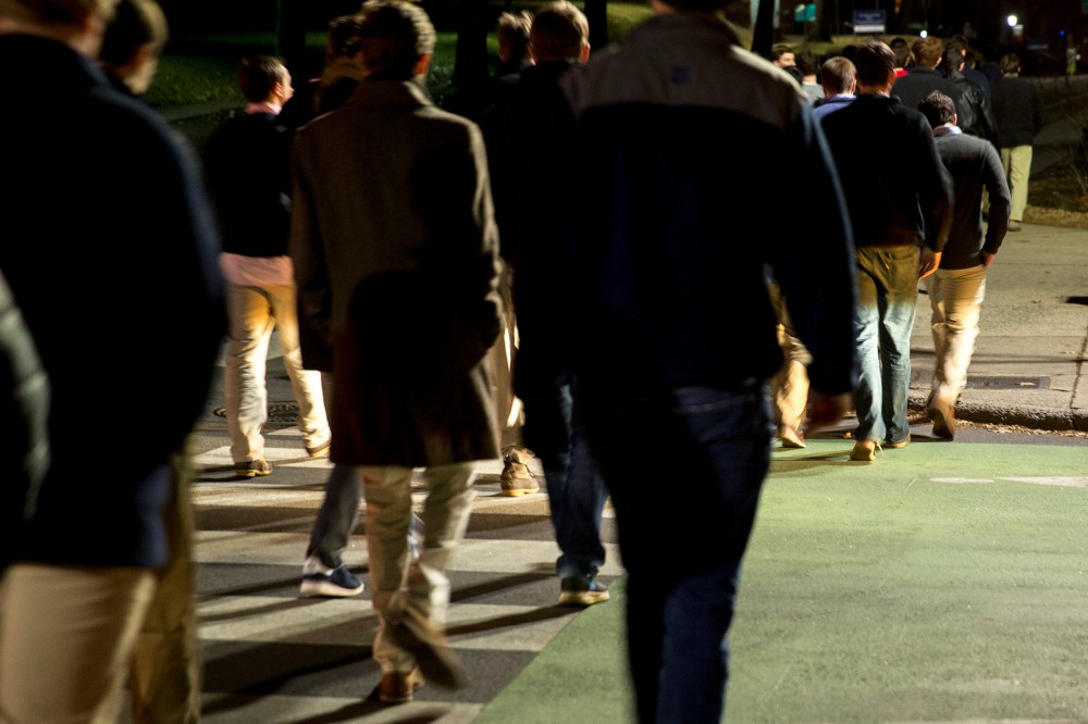 Students walk on Rugby Road towards fraternity houses during spring fraternity rush near the University of Virginia (UVA) campus in Charlottesville, Virginia, U.S., on Jan. 16, 2015. (Photo by Andrew Harrer/Bloomberg/Getty)