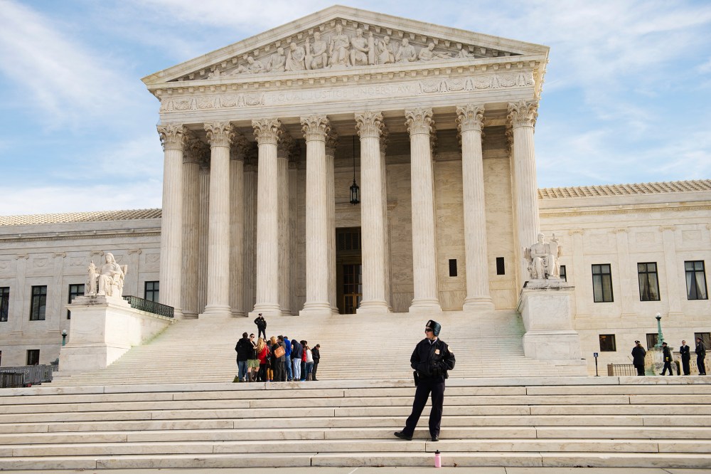 Visitors line up in front of the Supreme Court.