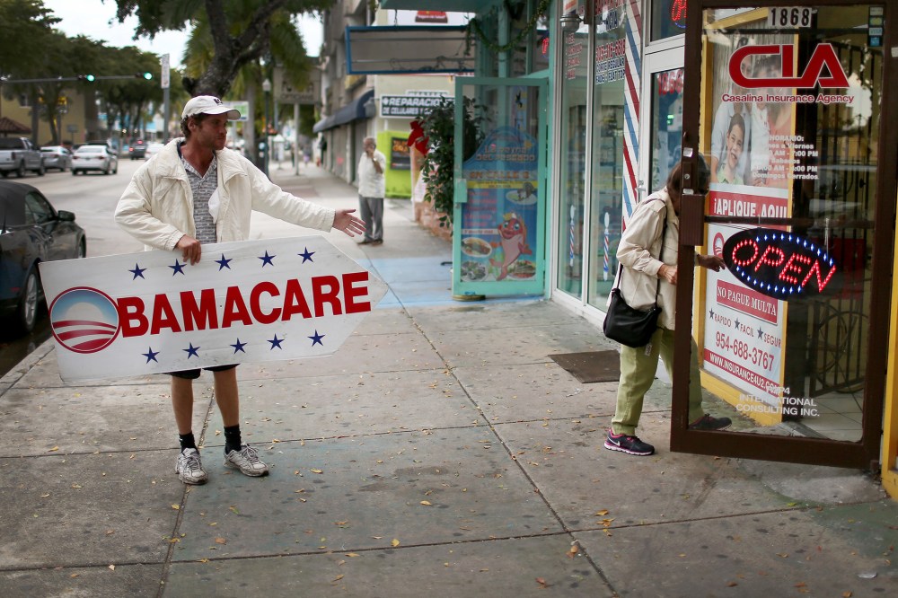 Pedro Rojas holds a sign directing people to an insurance company where they can sign up for the Affordable Care Act, also known as Obamacare, before the February 15th deadline on Feb. 5, 2015 in Miami, Fla.